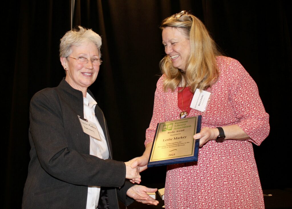 Leslie Markey of Brooks Memorial Library receiving the Birdie Award.