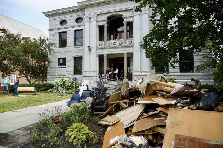 Piles of trash outside Kellogg-Hubbard Library in Montpelier, VT, following destructive flooding in July 2023.